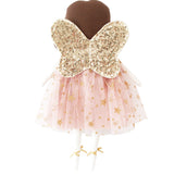 Blush gold fairy doll with glitter butterfly wings and pink star-patterned tulle skirt.