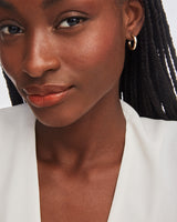 Colette Huggie Earrings in Gold by Kendra Scott