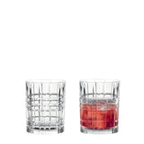 Two Amaris cocktail glasses in cut crystal, one empty and one with a red drink