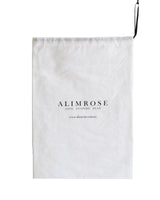 White drawstring fabric bag with Alimrose logo and black ribbon string closure.