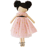 Fair-skinned doll with brunette hair in two pom-pom buns wearing a pink starry tulle ballerina dress and black ballet shoes.