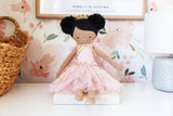 48cm soft cloth doll with ebony skin, black puffy hair, and pink floral dress with gold ribbon bow.