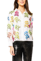 White neon skull and crossbones button-up top on model
