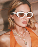 Mikki Metal Huggie Earrings in Gold by Kendra Scott